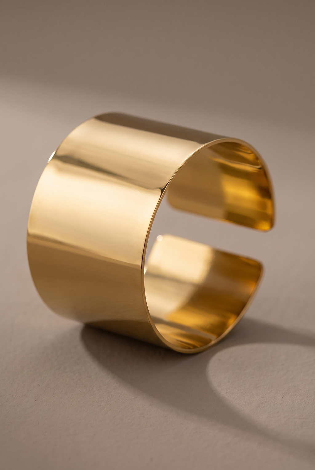 Close-up of the smooth band and open end of the gold cuff